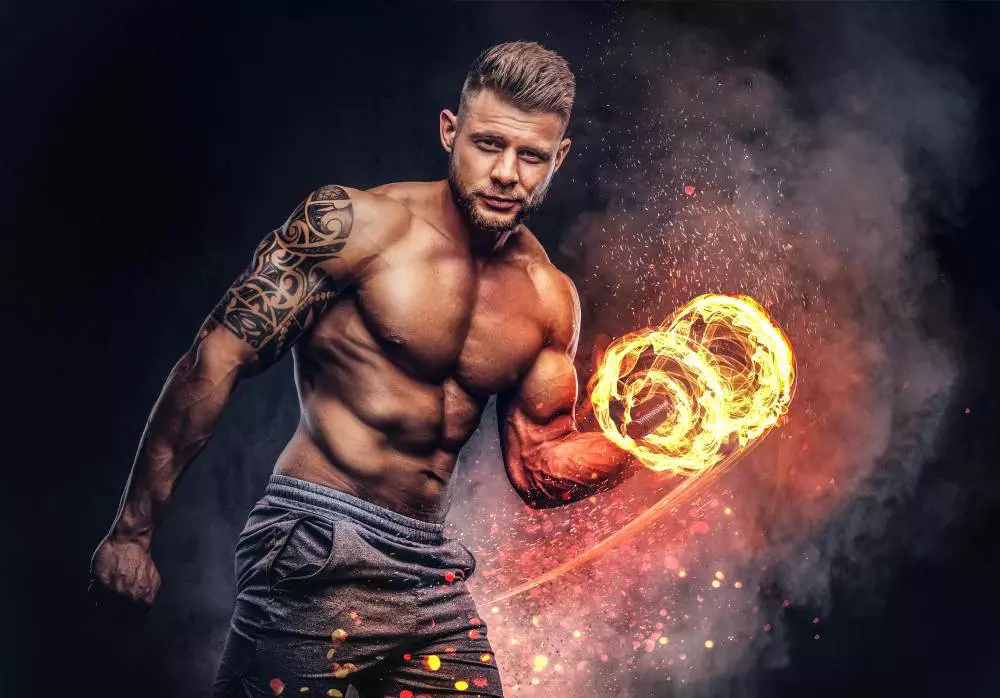 A man holding a fire ring on a dark background, showcasing an enthralling circus act.